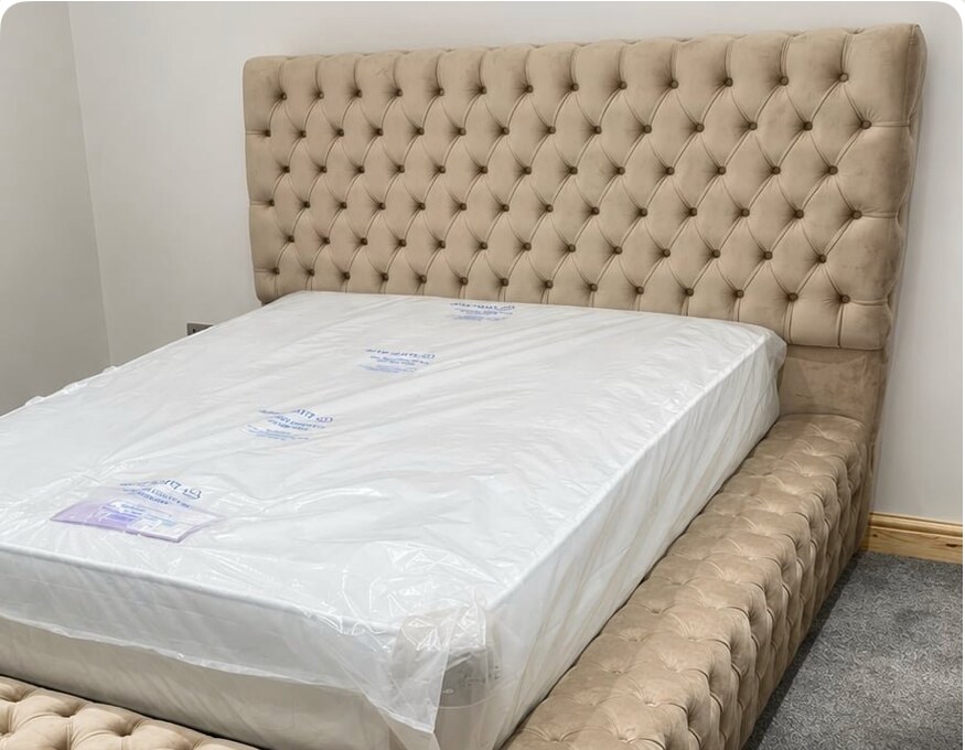 Close view of a champagne Chesterfield Ambassador bed
