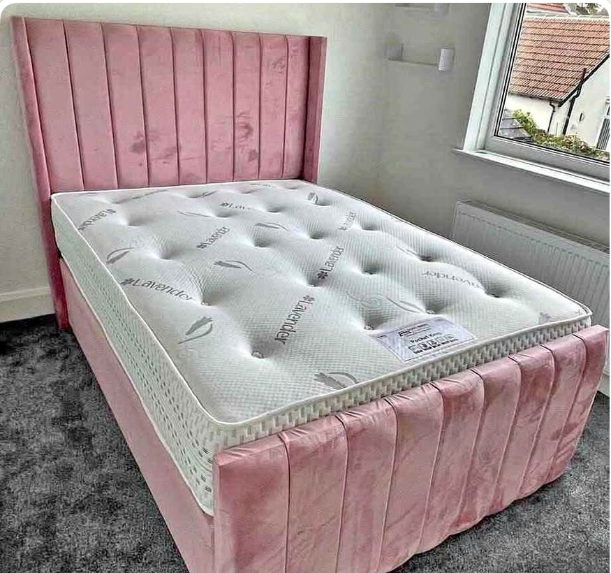 Pink upholstered Panel Wing bed