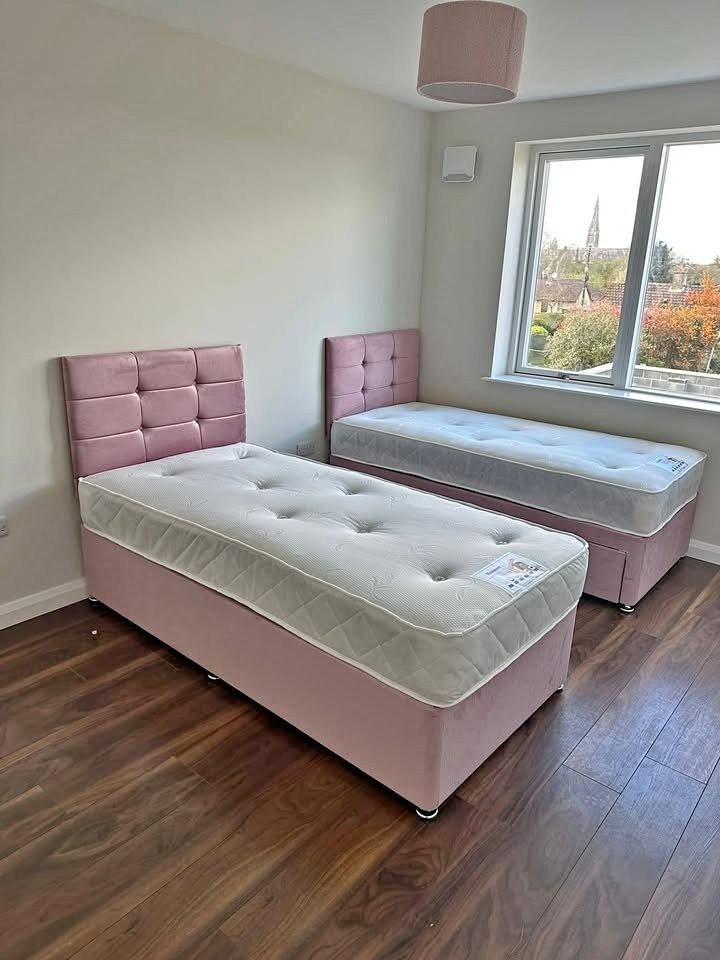 Two matching pink single divans